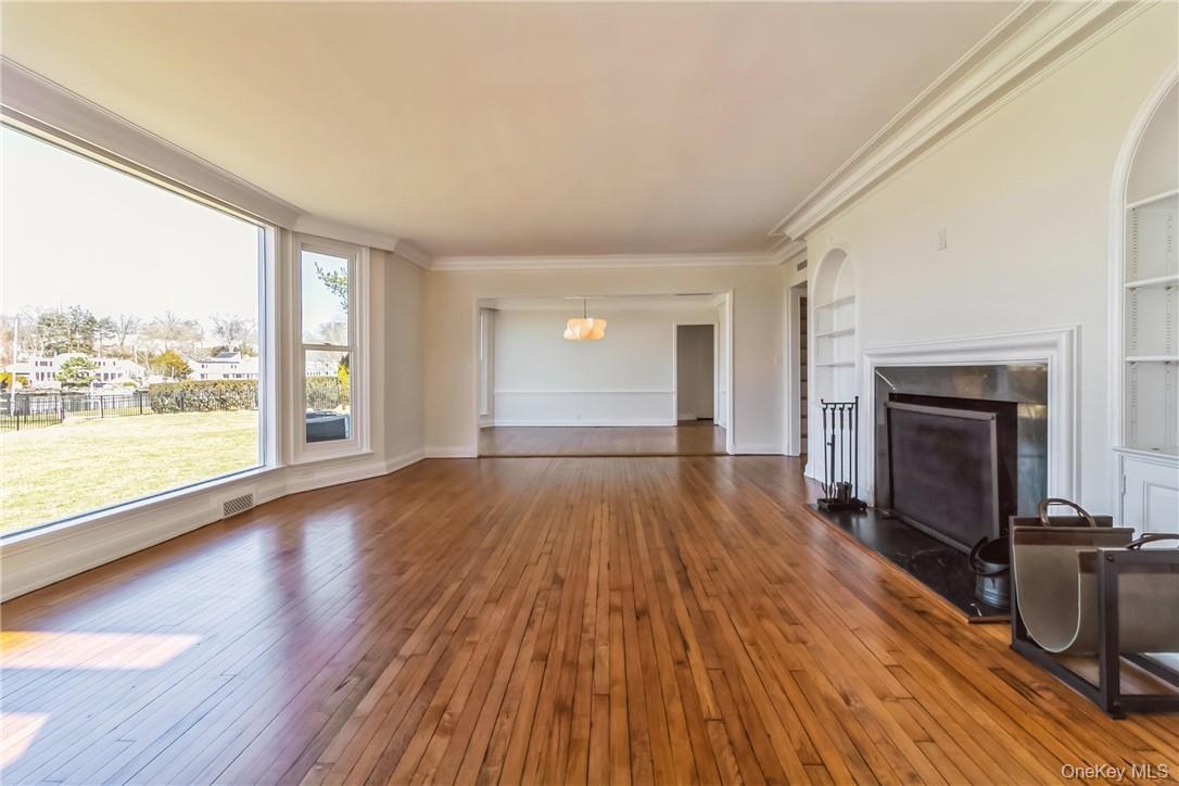 Spacious living room with wood burning fireplace
