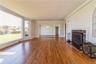 Spacious living room with wood burning fireplace