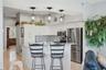 Walk past the kitchen to a spacious bedroom currently being used as an office.