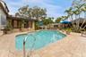 Pavered deck with Pebbletec pool