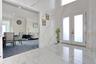 Entrance foyer with french doors, marble tiled floors, recessed lighting, and ornamental molding