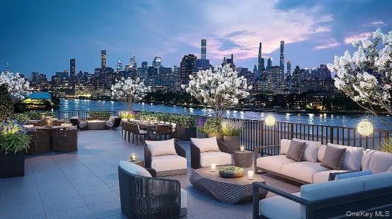 Expansive rooftop terrace with a riverfront backdrop, featuring multiple seating areas, a dining space, and integrated planters with flowering trees