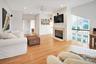 Second Floor Living area with ornamental molding, recessed lighting, light wood-style floors, a ceiling fan, and a glass covered fireplace. Gorgeous V