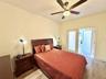 Bedroom 2 with french doors to the front porch