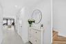 Door to right is a closet for under stairs storage, and the next door is the 1/2 bathroom