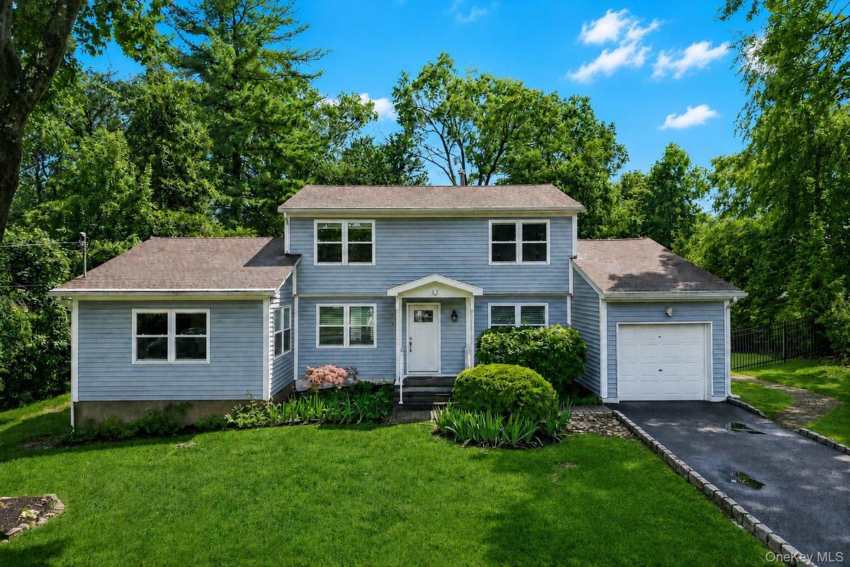 Move-in ready! Totally renovated 4/5 bedroom home in prime New City location