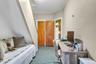 Stairs to top floor and spacious bedroom.