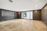 Spare room with wooden walls and recessed lighting