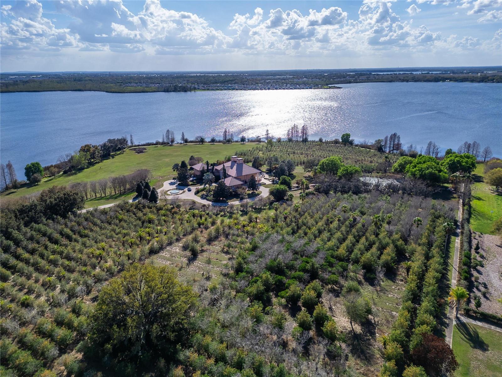 A rare opportunity to own one of Auburndale’s most impressive private estates. Set on 44.30 beautifully landscaped acres with more than 2,300 feet of 