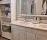 Double vanity with integrated sinks and a reflective mirror