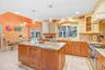 Kitchen island includes plenty of storage and built-in microwave.