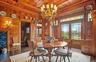Dining room with french doors, wooden ceiling, wood walls, and wood finished floors