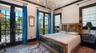 Guest suite with dramatic floor-to-ceiling windows
