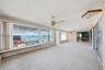 View from family room looking south towards the turquoise waters of the Intracoastal. The existing kitchen area, living room, dining room, family roo