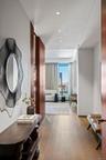 Corridor with recessed lighting and wood finished floors