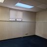 Empty room with a paneled ceiling