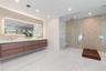 Primary bedroom on ground floor, sliding door into the backyard.