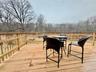 0 - Wooden deck with a view of trees from master bedroom