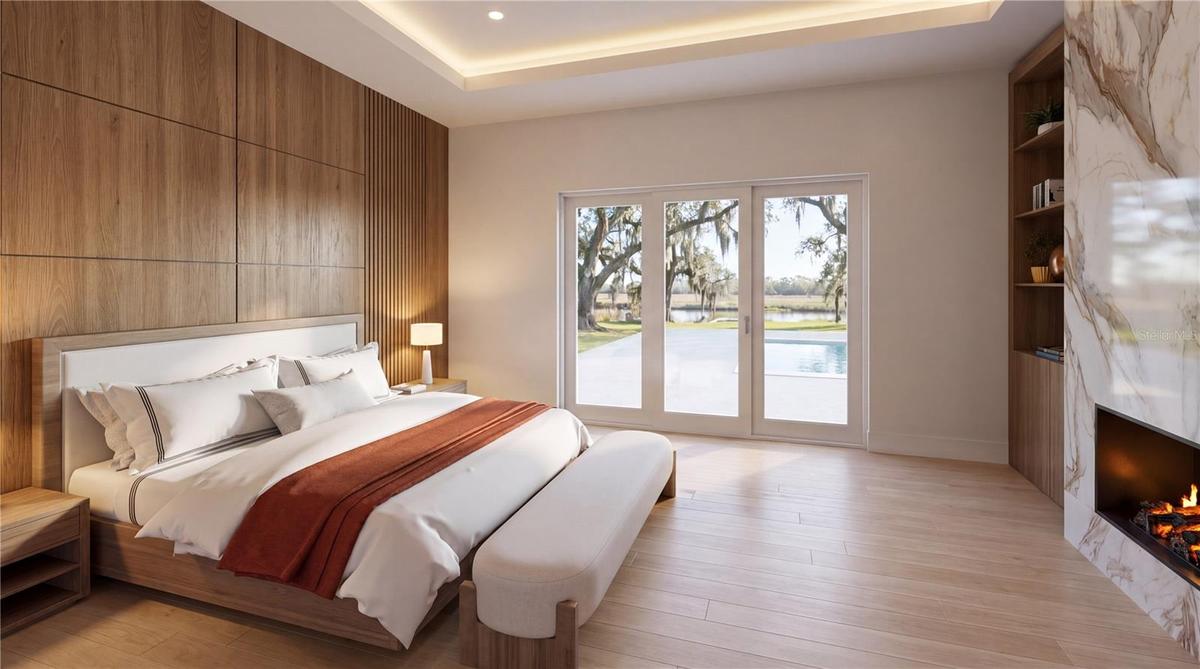 Primary bedroom with fireplace and serene finishes for blissful sleep