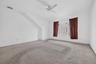 The second upstairs bedroom offers generous space and great potential, ready to be refreshed with new carpeting and your favorite paint color.