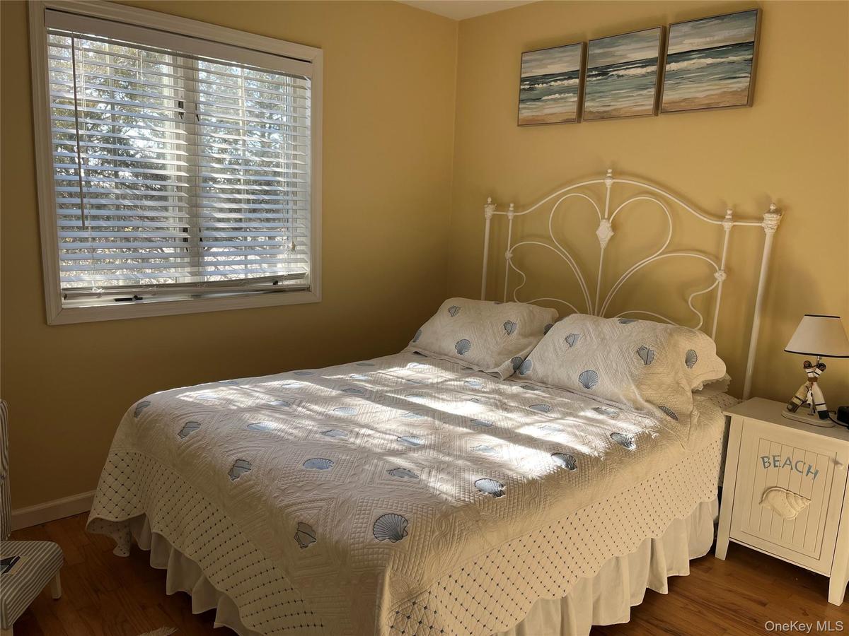 Bedroom featuring dark wood-style floors