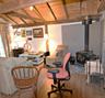 Wood-finish flooring throughout, complemented by exposed wood ceiling beams and planking