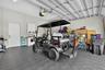Two car garage with golf cart included.  Cabinets, mud sink, refrigerator
