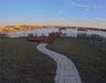 View of rear dock & lake-frontage at sunset