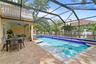 Resort-style pool & spa with mature tropical landscaping