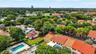 Check out the proximity to the Hard Rock Guitar Hotel. See community pool behind the property (and currently not in use tennis court). Tree lined comm