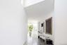 Hallway featuring concrete flooring