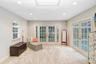 Master bedroom has large sitting area with French doors to pool/patio area.  This area can also be used for yoga,or office space etc.
