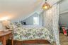 2nd upstairs Bedroom with lofted ceiling and hardwood / wood-style floors