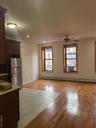 Unfurnished living room with baseboard heating, baseboards, light wood-style floors, ceiling fan, and recessed lighting