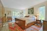 Primary bedroom with access to private deck.