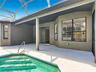 Enjoy your private screened-in pool, perfect for Florida living year-round