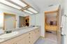 Primary bathroom with oversized cast iron soaker tub, separate shower and water closet