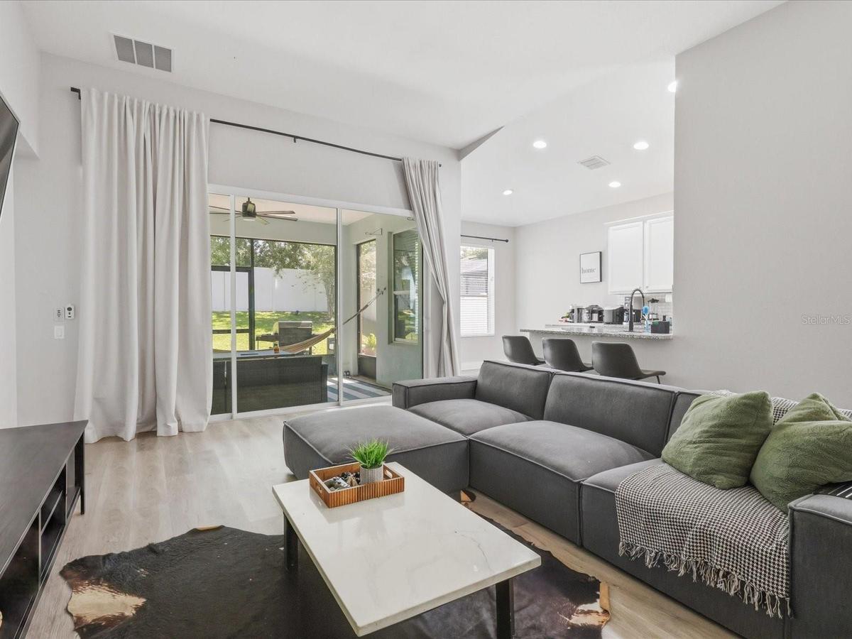 Living room and view of the covered ans screened lanai