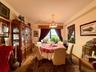 Open to the living room, double panel window, hardwood floors