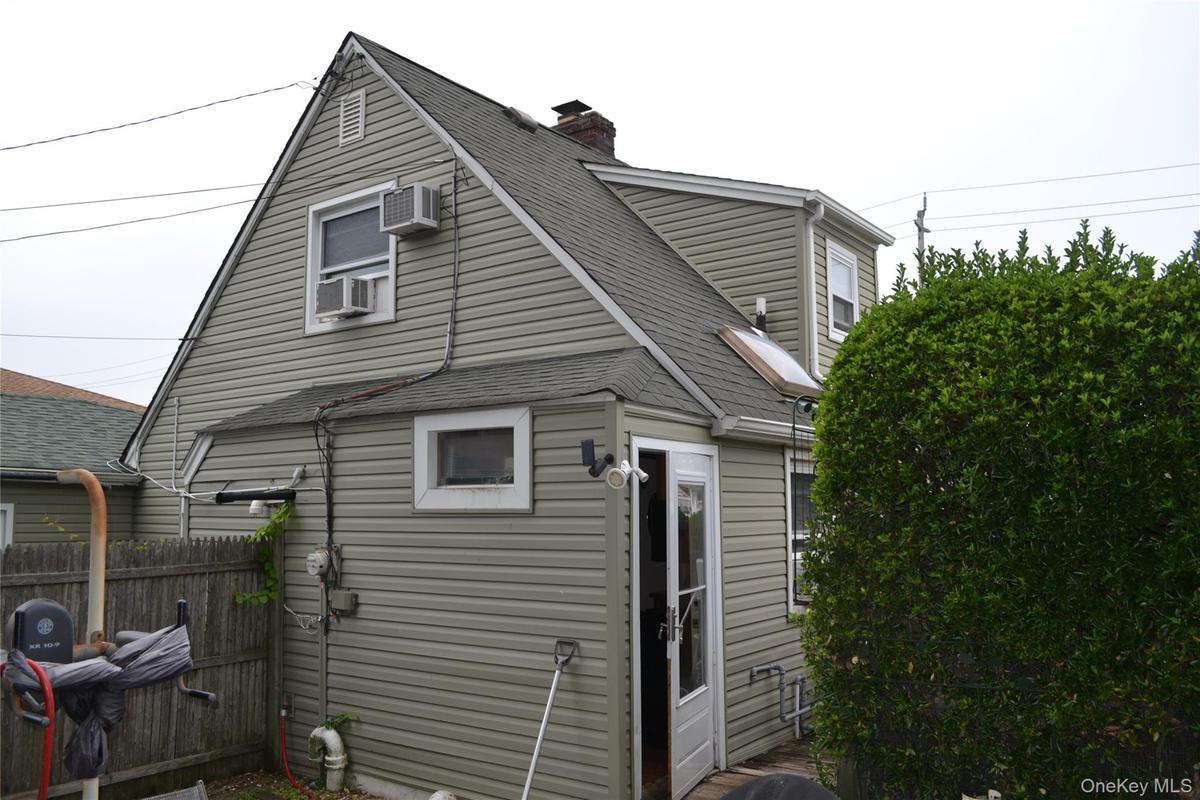 Rear house showing side door entrance to kitchen