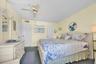 Primary bedroom with balcony access