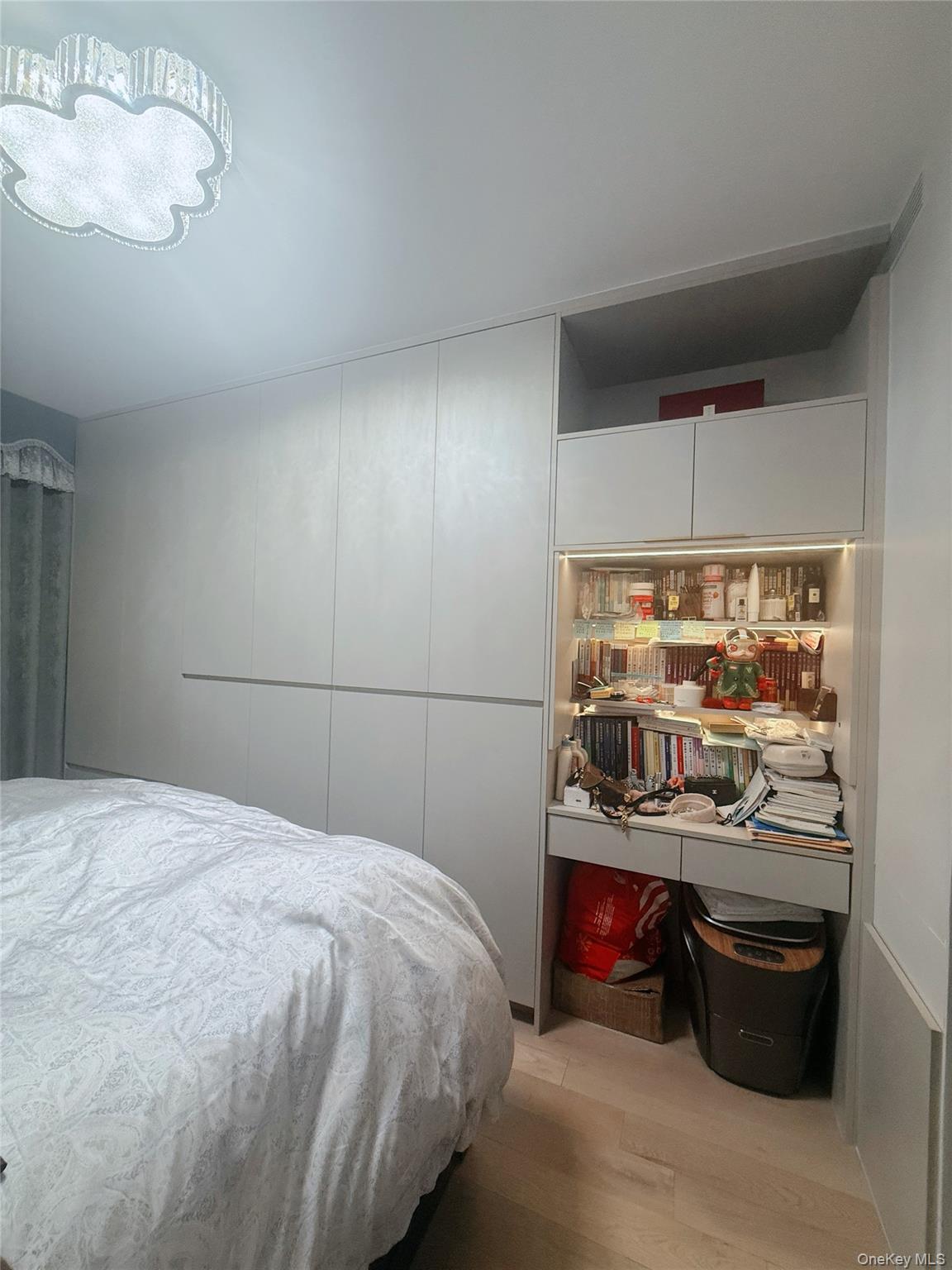 Bedroom with light wood finished floors