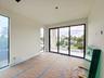 (as of April 8, 2026) the 2nd guest bedroom on the second level features also features full-height pictures windows along with access to a shared pati