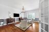 Hardwood flooring, crown molding, double doors and custom decorative antler chandelier