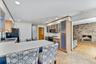 Kitchen with Breakfast Bar Area and View into Family Room
