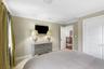 Crown molding and neutral wall tones create a refined aesthetic