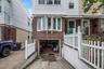 Driveway and garage below home.