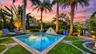 Private resort-style pool at sunset
