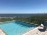 Outdoor pool with a water view