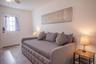 sofa bed, side table with lamp
